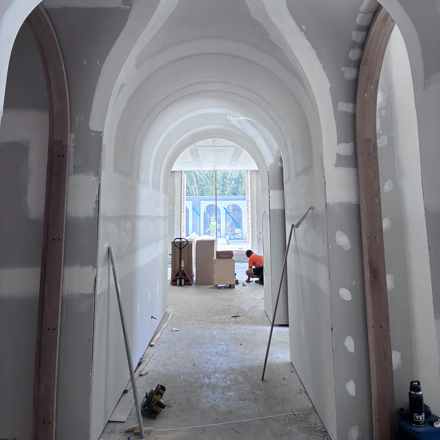 Renovated arched plaster hallway