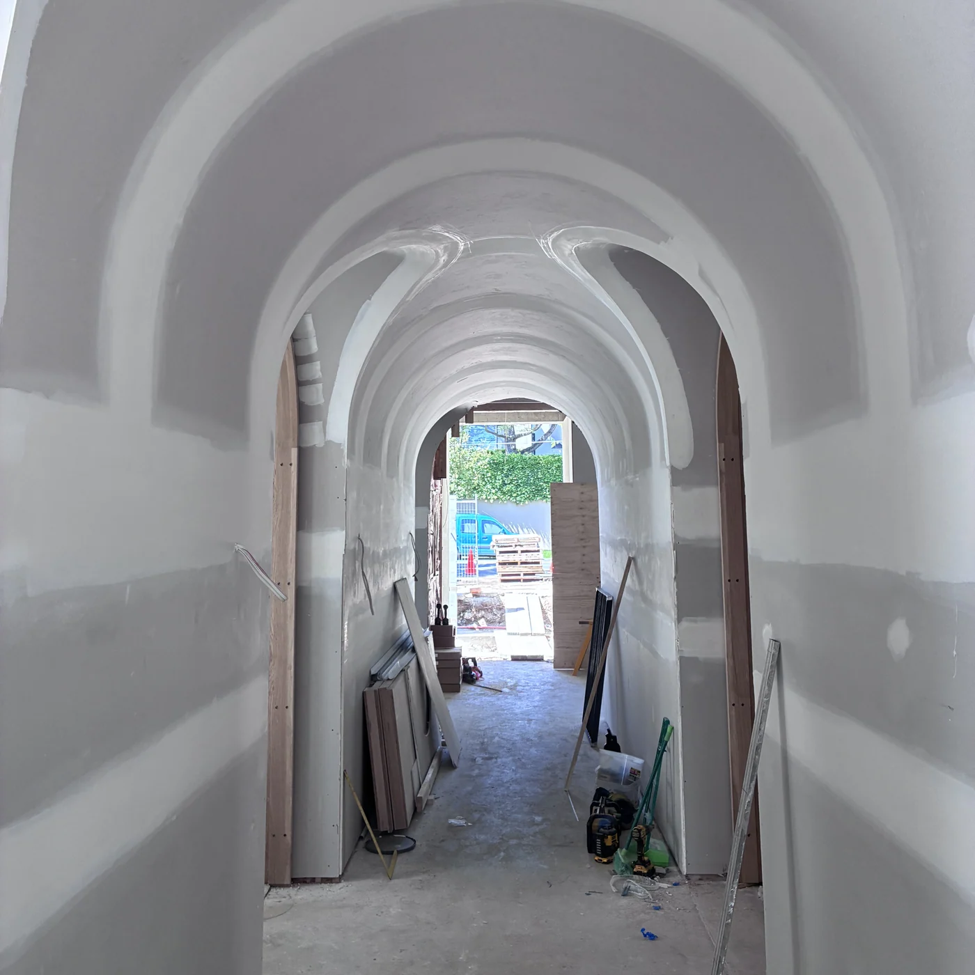 Arched, timber-lined vaulted hallway