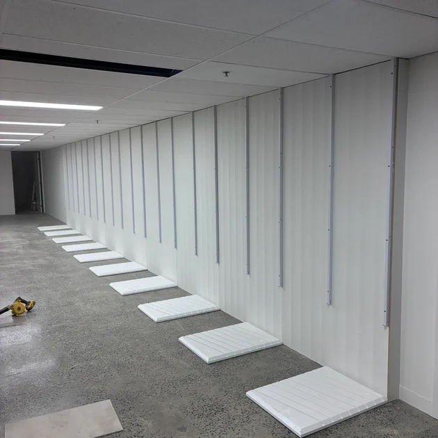 Interior wall cladding installed in a fit-out