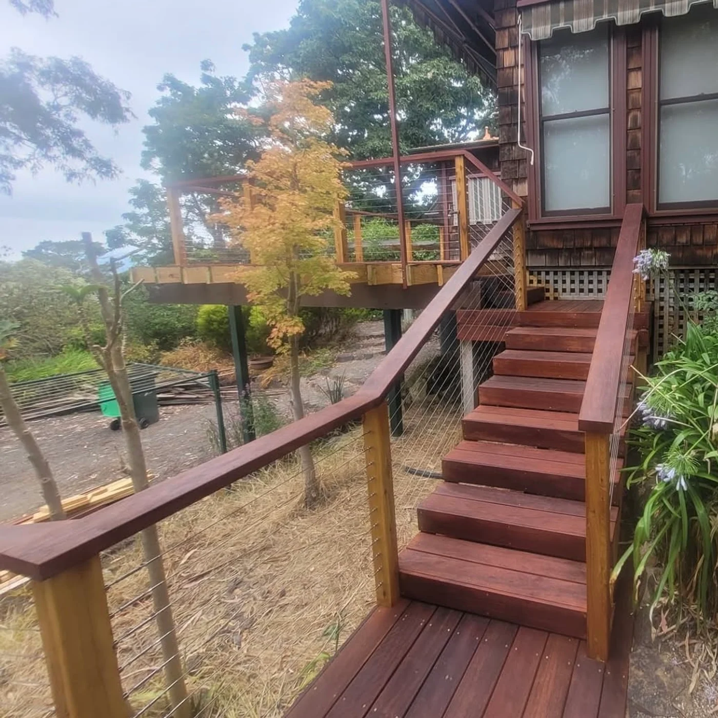 Timber deck with stairs and landing in a garden setting