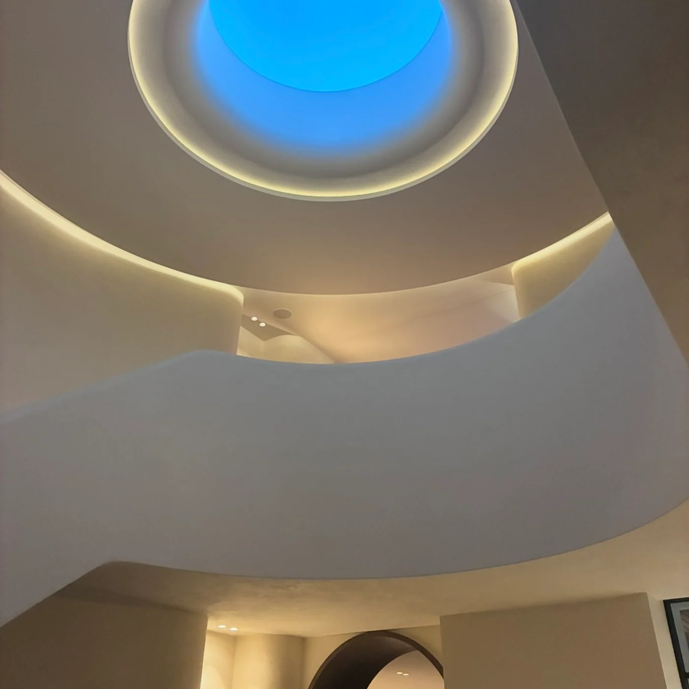 Round skylight set into curved plaster